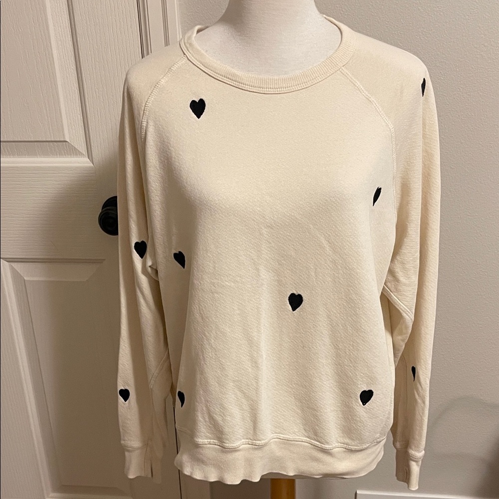 THE GREAT. Ivory Sweatshirt with Black Heart Details